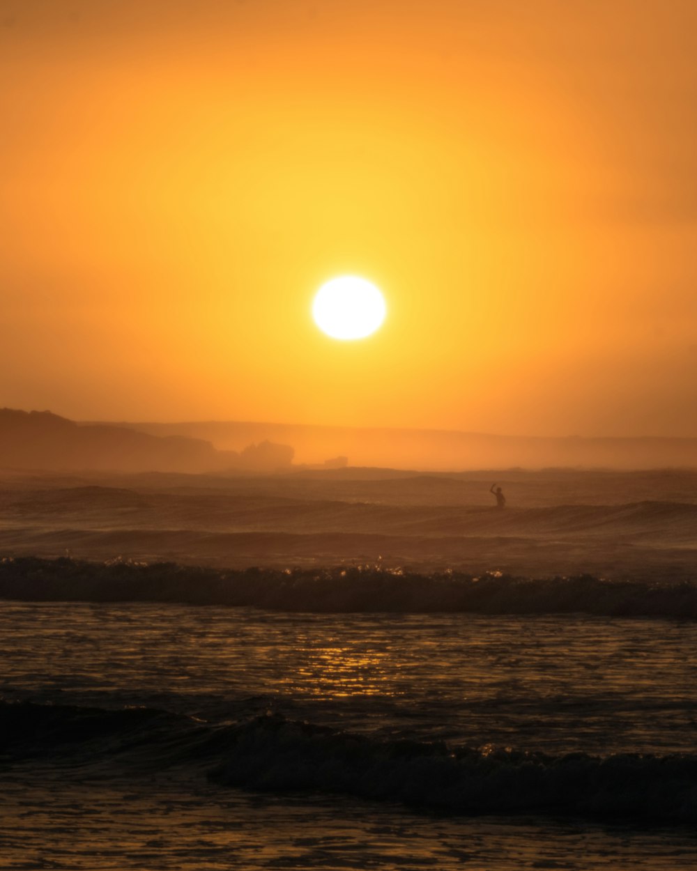 body of water during sunset