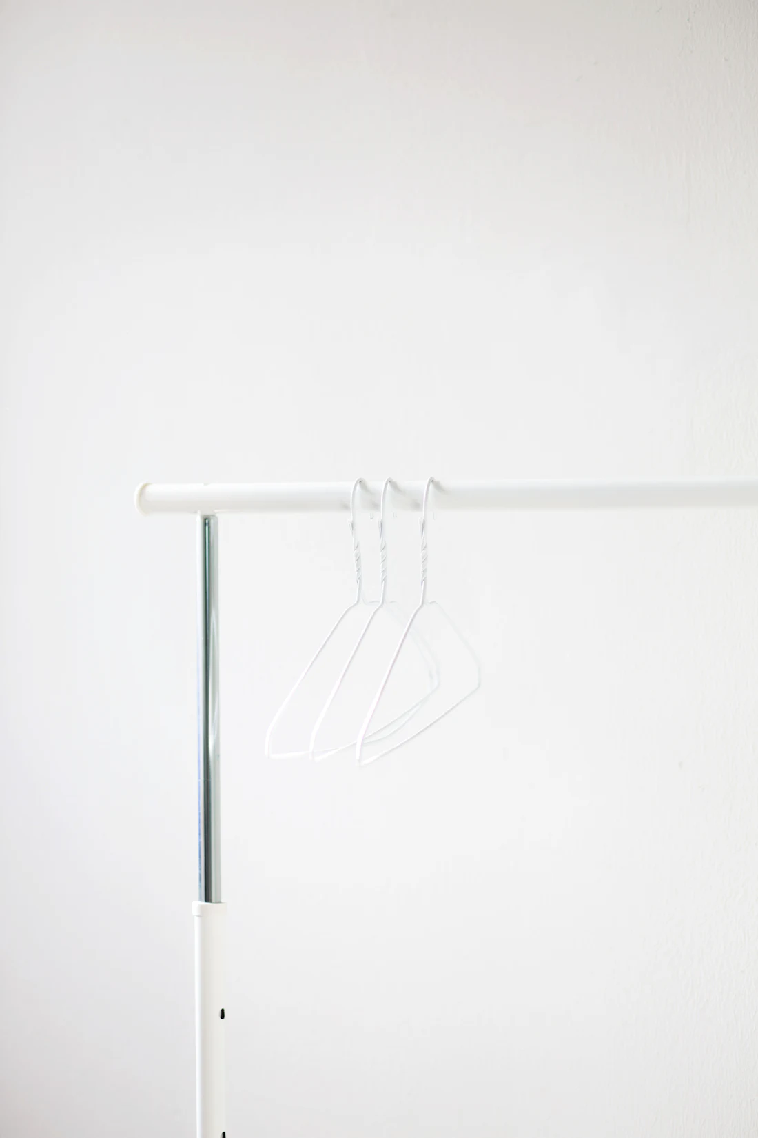 Well-kept clothes hanging neatly on a rail