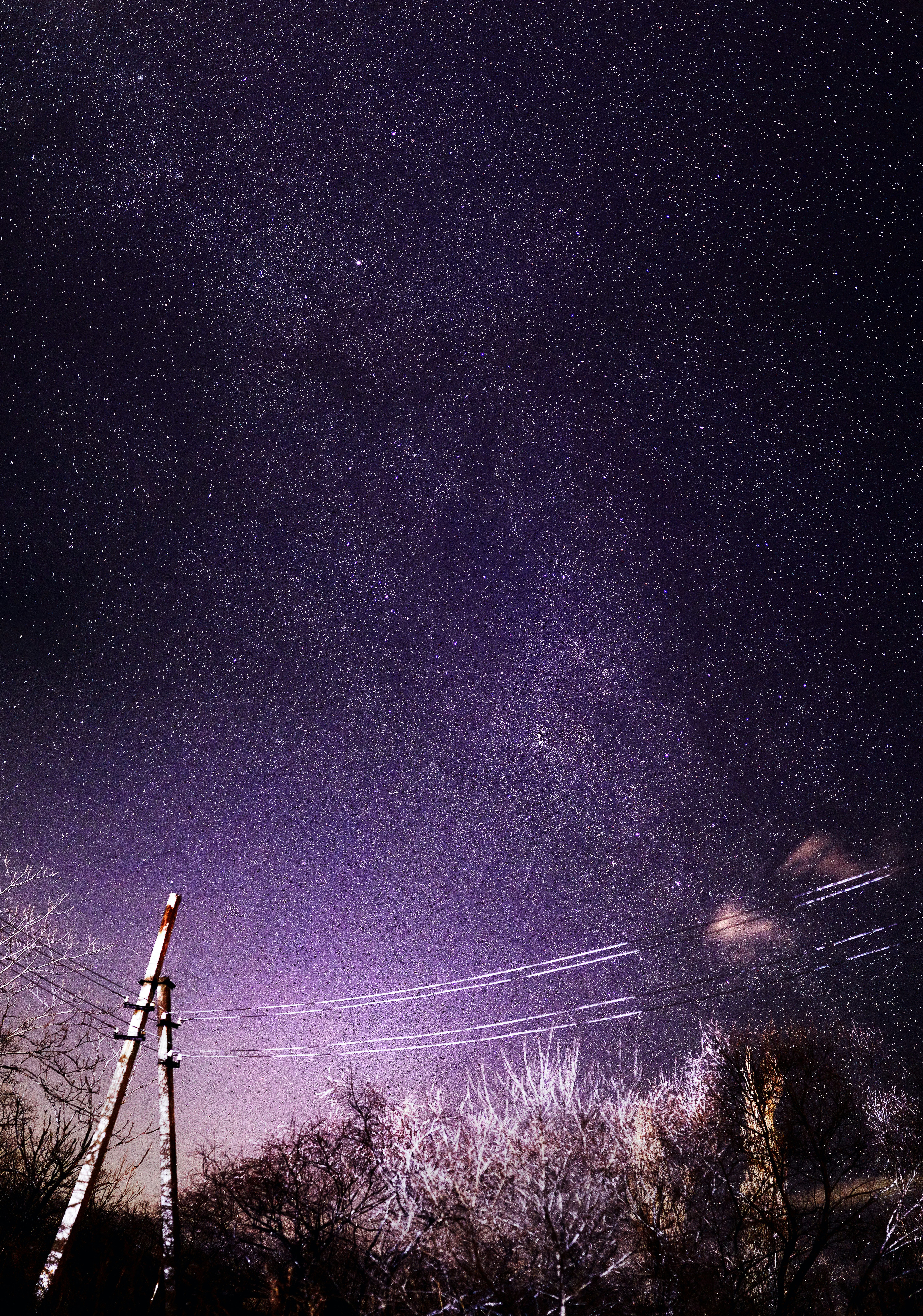 black electric post under starry night