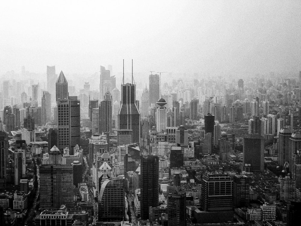 grayscale photo of city buildings