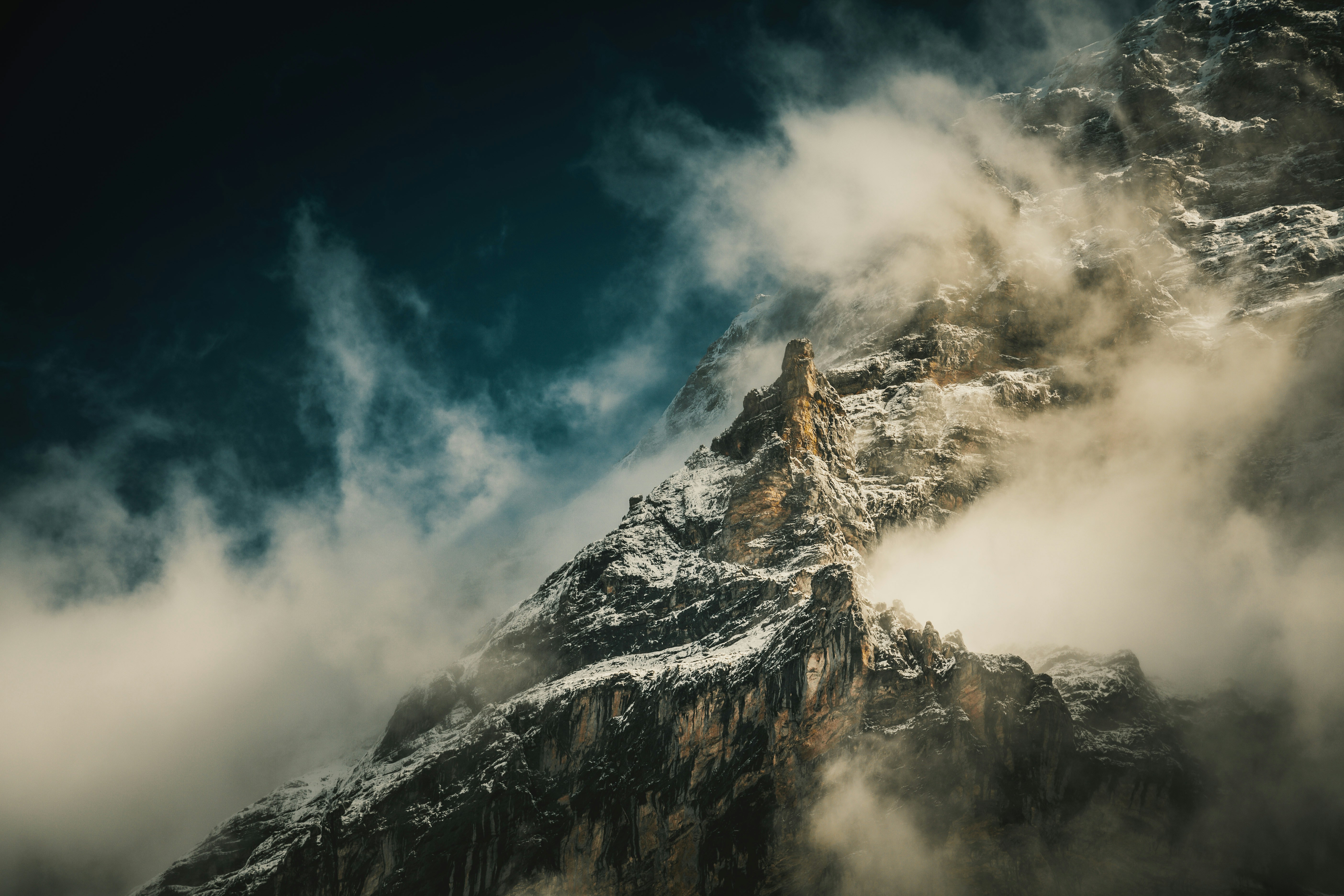 black and white mountain under blue sky