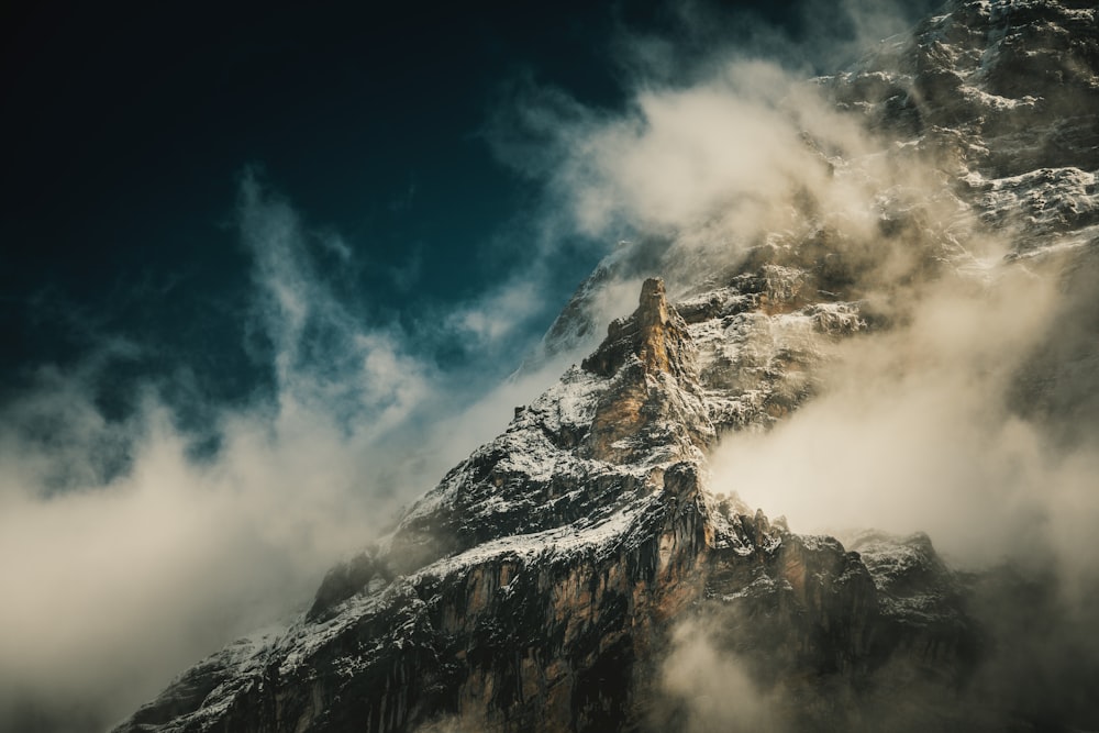 black and white mountain under blue sky