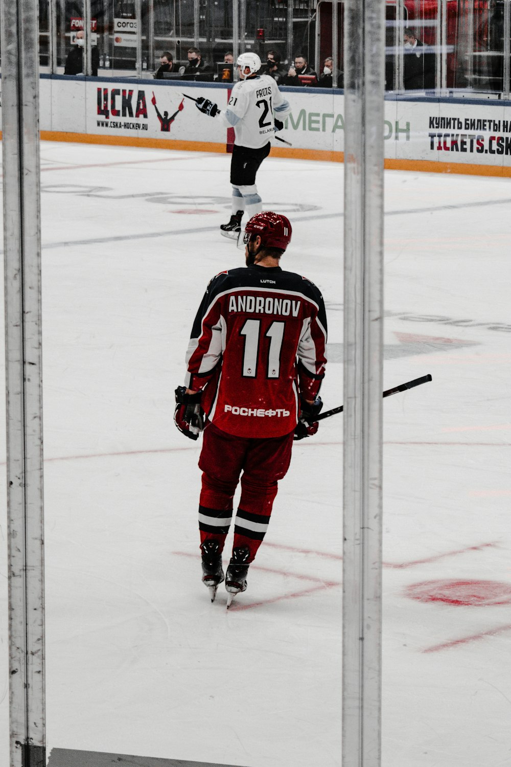 man in red and white ice hockey jersey