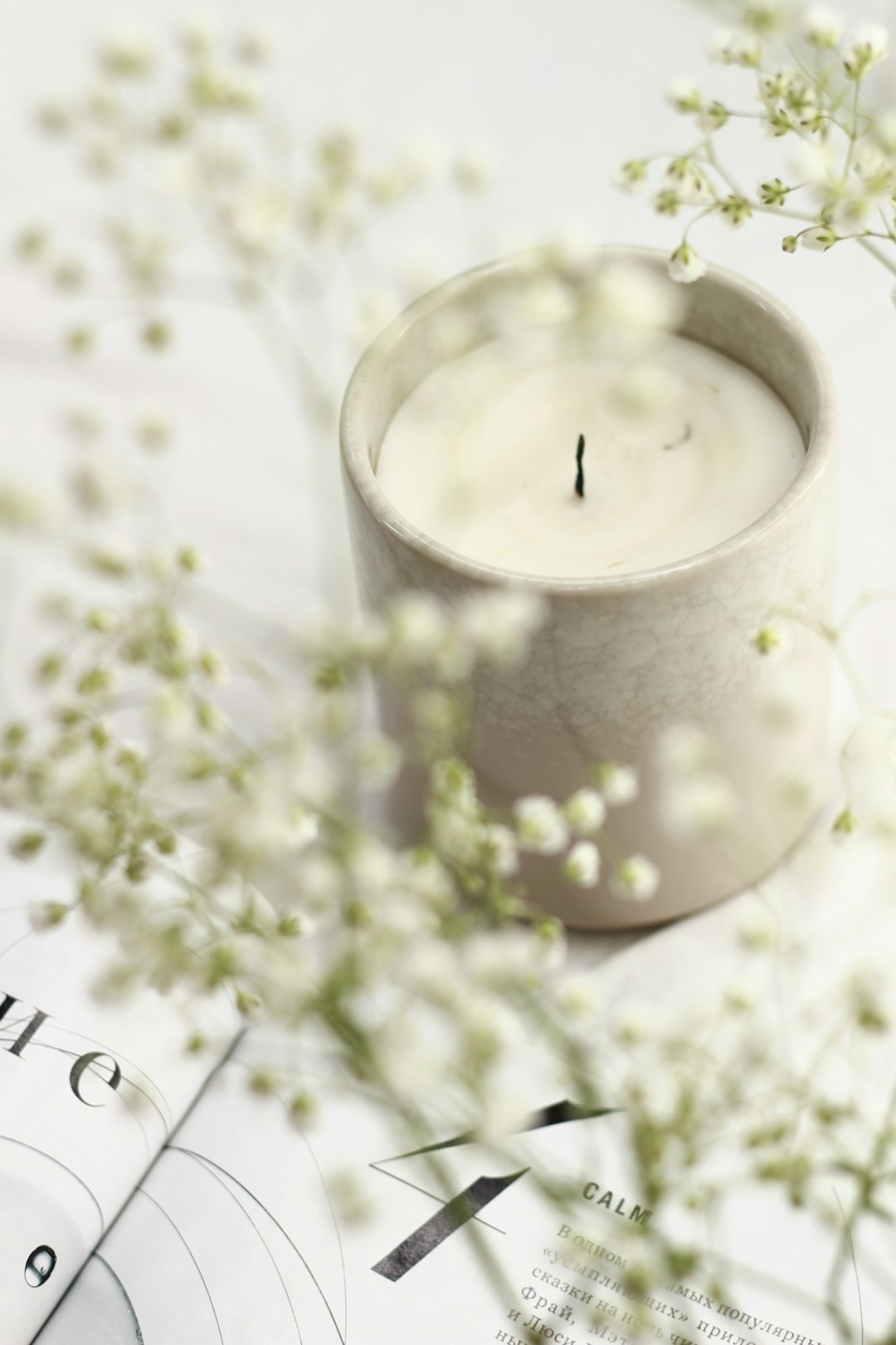  white candle in clear glass holder candle