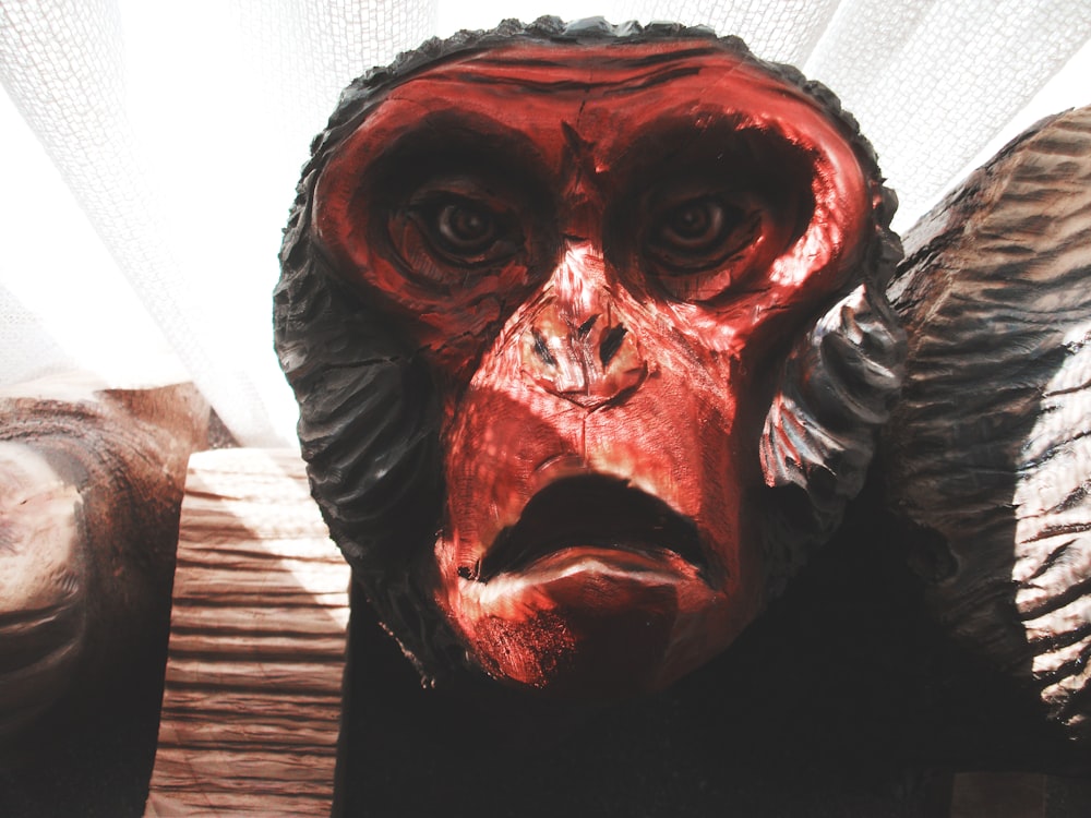 man in black shirt with red and white face paint