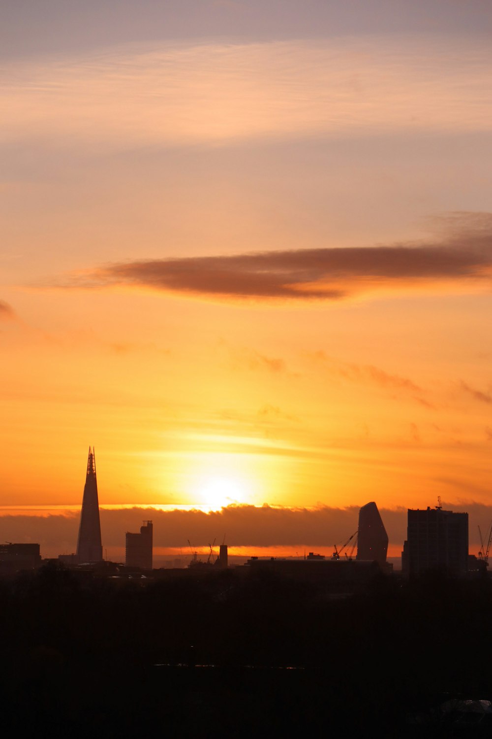 silhouette of building during sunset