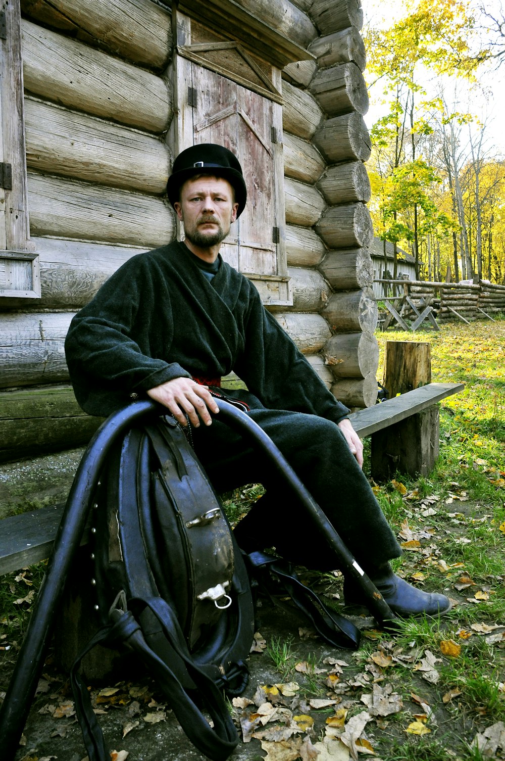 man in black jacket sitting on black wheel chair