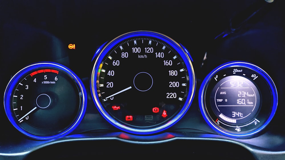 black and blue car speedometer