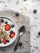 stainless steel spoon on white ceramic plate