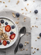 stainless steel spoon on white ceramic plate