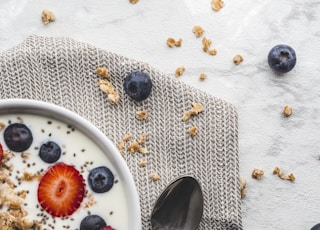 stainless steel spoon on white ceramic plate