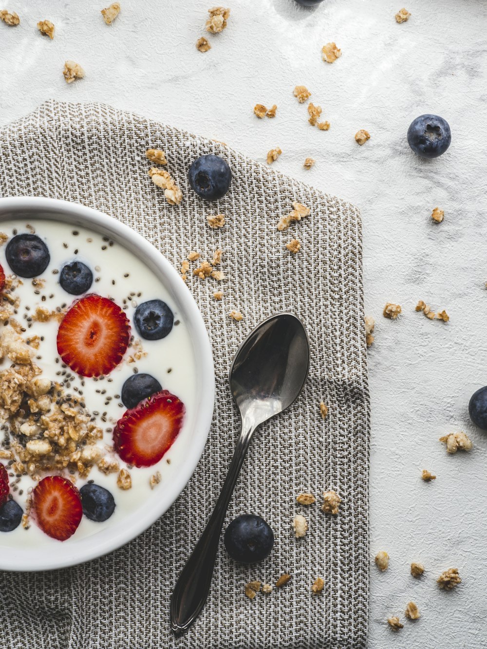 stainless steel spoon on white ceramic plate