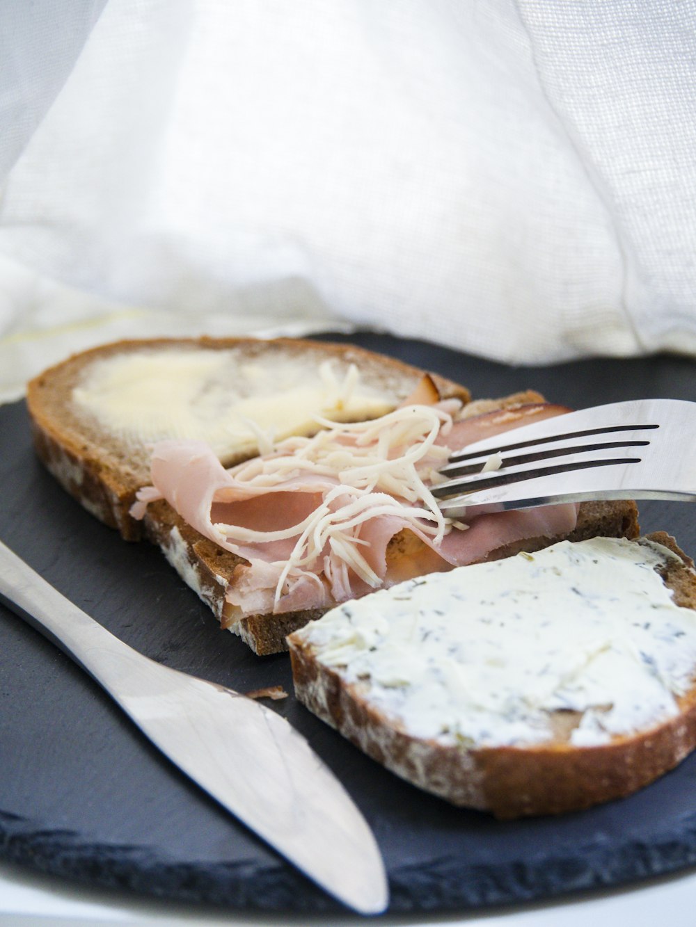 bread with cheese on white paper towel