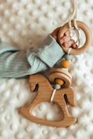 A charming gift set for newborns, including a teething ring and a soft cloth.