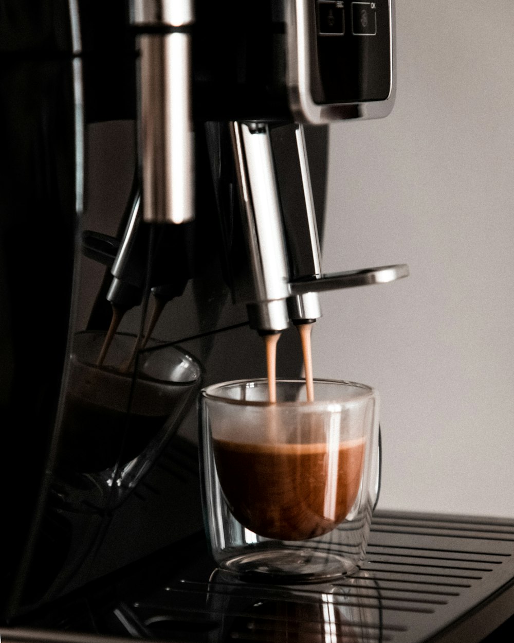 a espresso machine making a cup of coffee