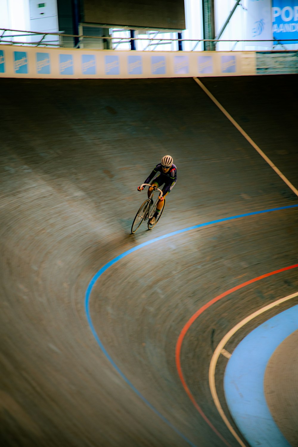 man riding bicycle on track field