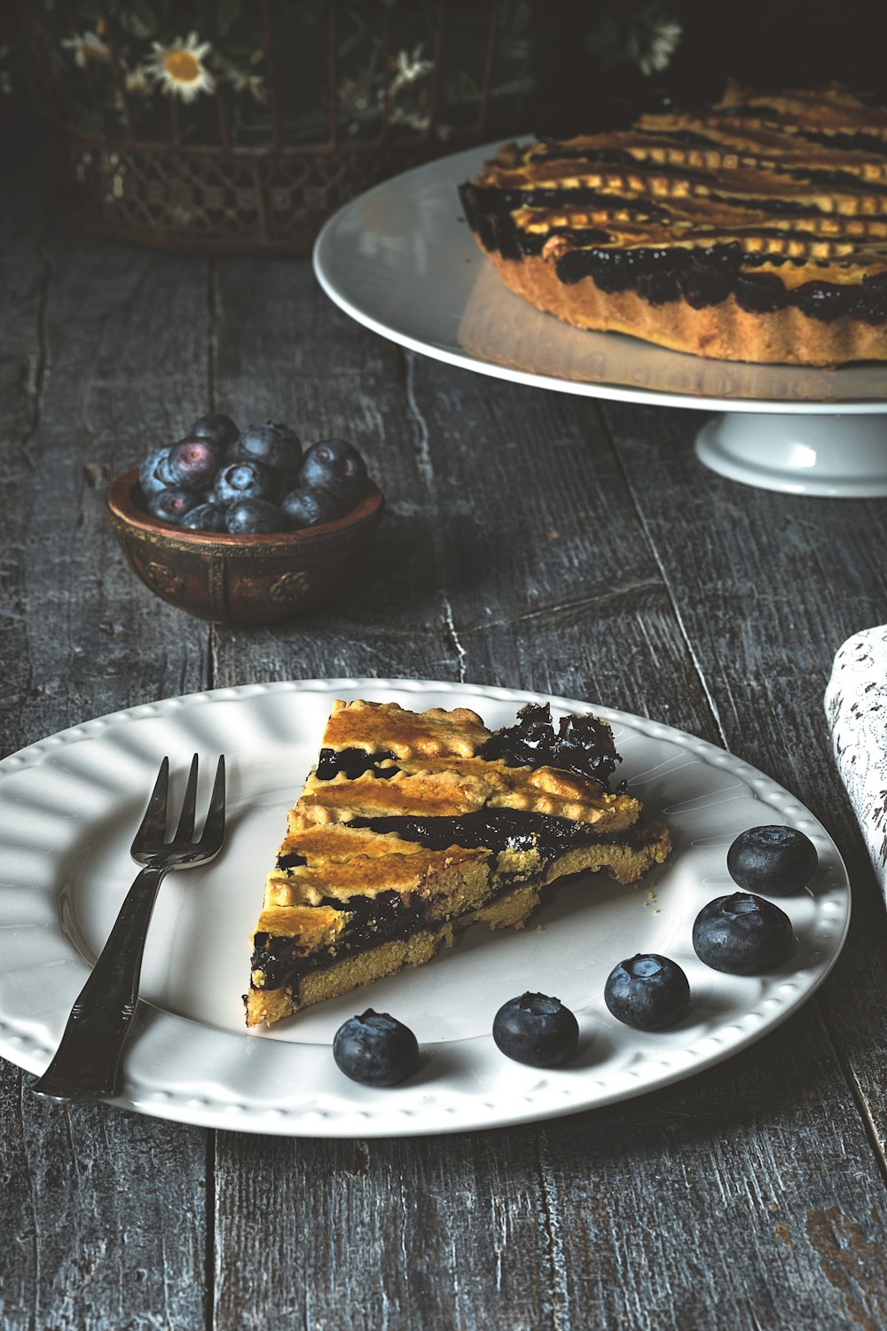 sliced of cake on white ceramic plate