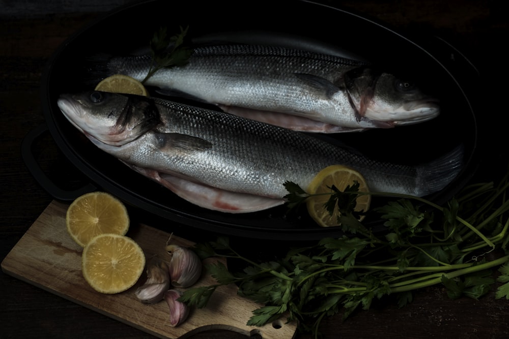 silver fish on brown wooden table