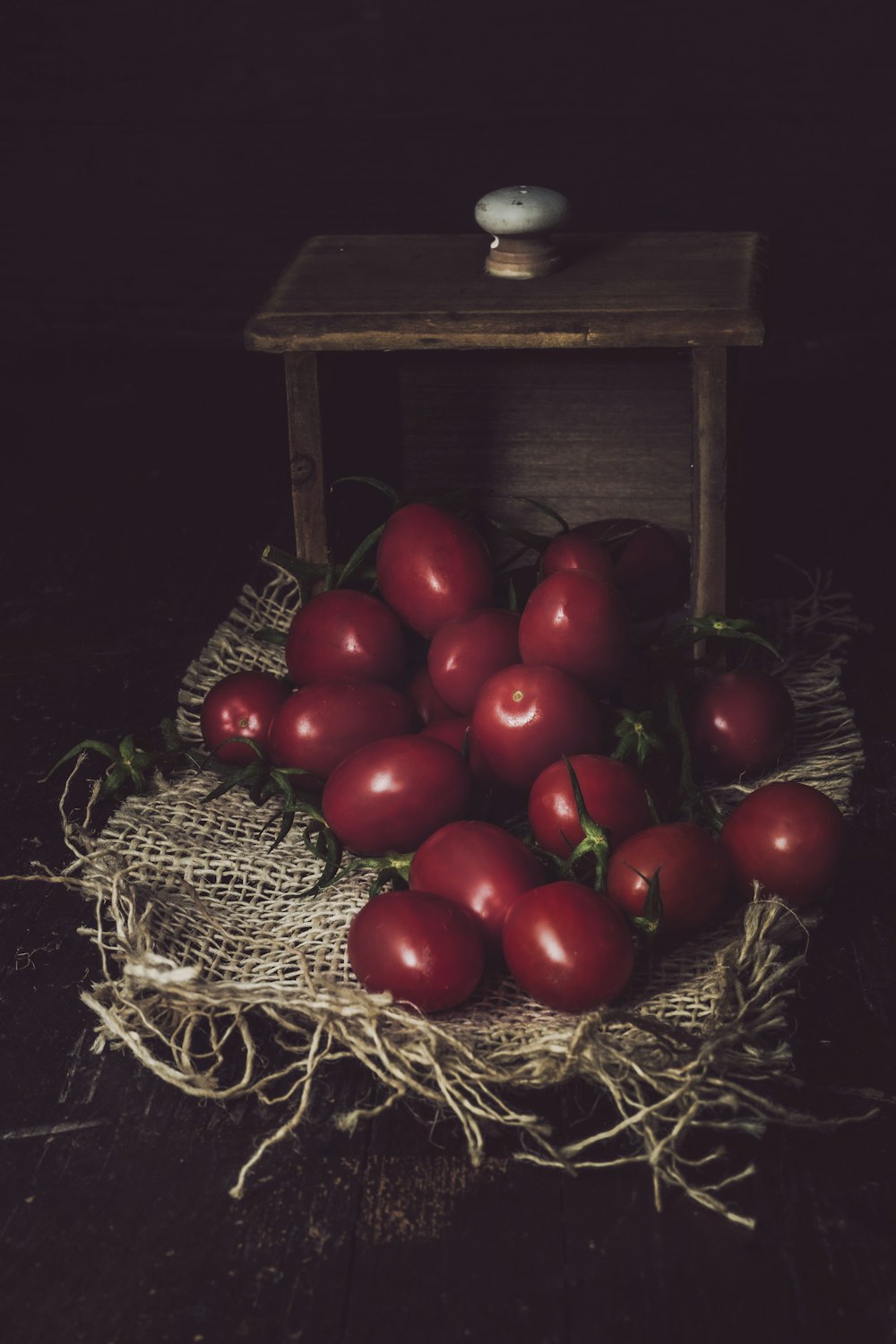 red round fruits on brown woven basket