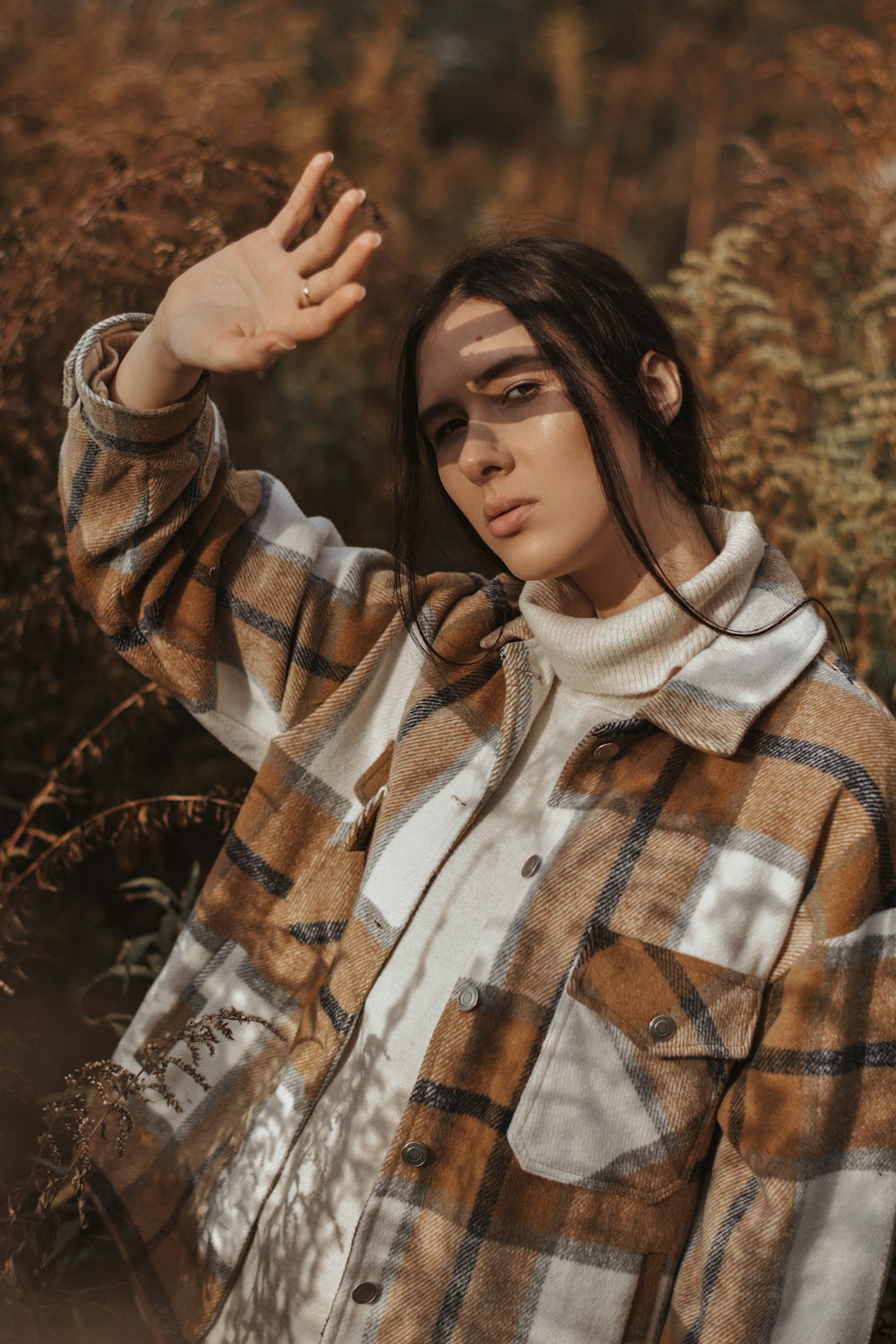 woman in white and brown plaid button up long sleeve shirt