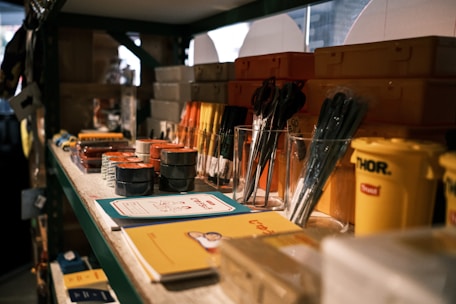 black and silver makeup brushes on clear glass container