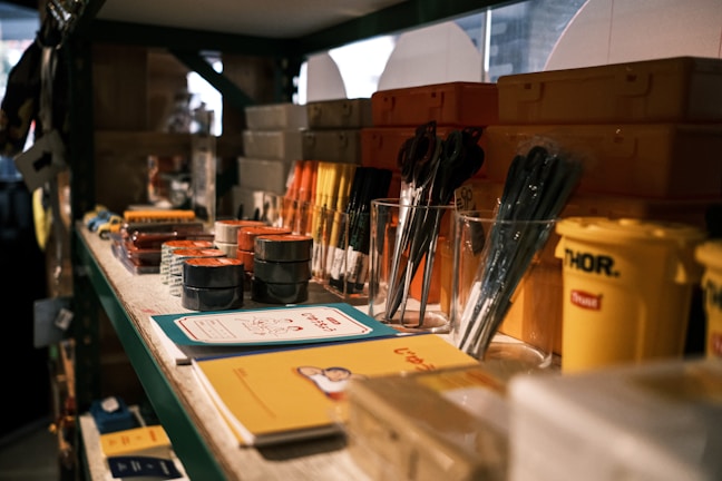 black and silver makeup brushes on clear glass container