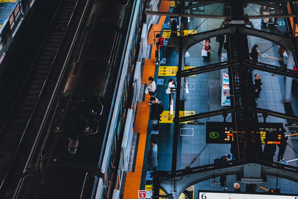 black and orange train in a city