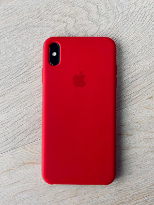 Sleek smartphone with colorful protective case on a wooden table