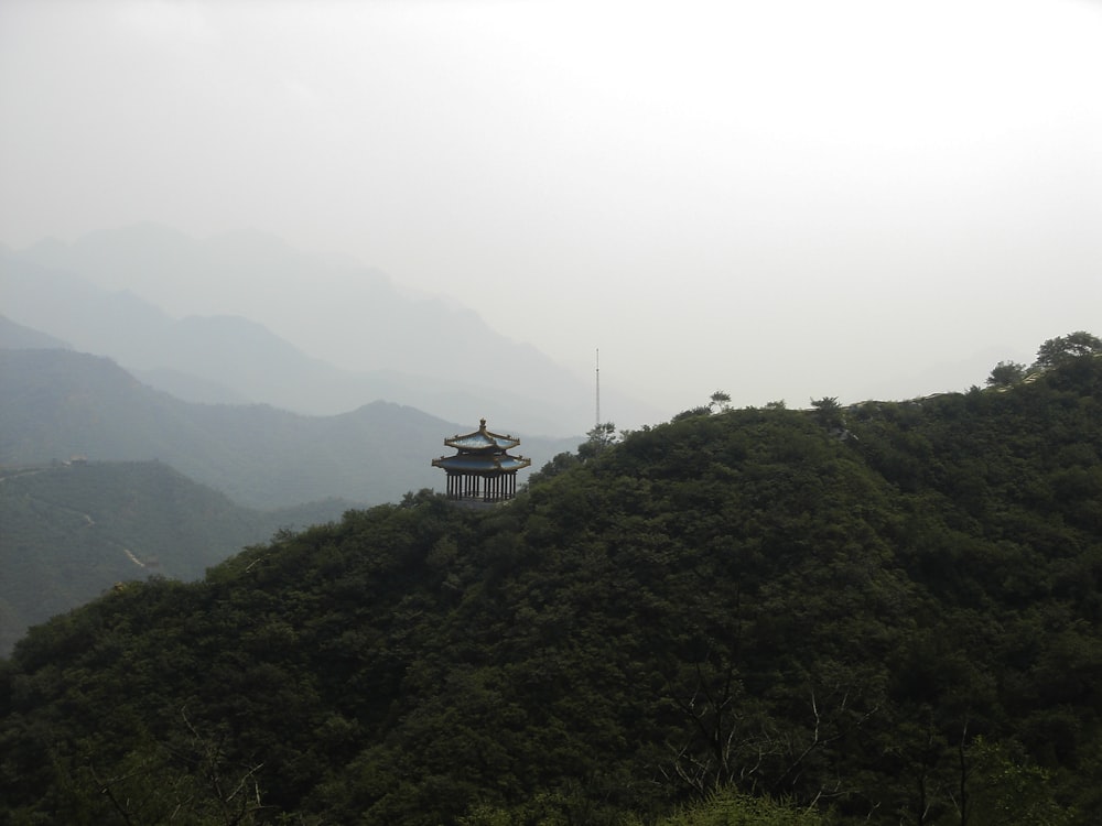 black and white tower on top of the mountain