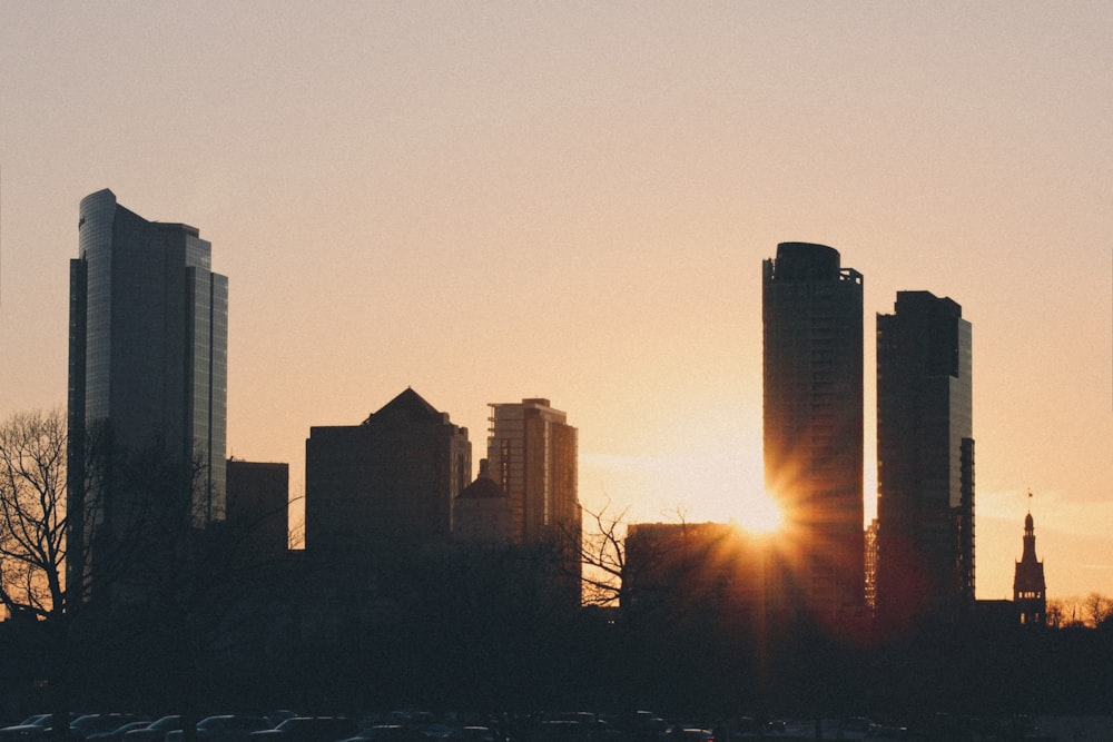 silhouette of city buildings during sunset