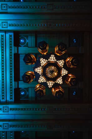 Intricate wooden ceiling design with integrated lighting highlighting craftsmanship.