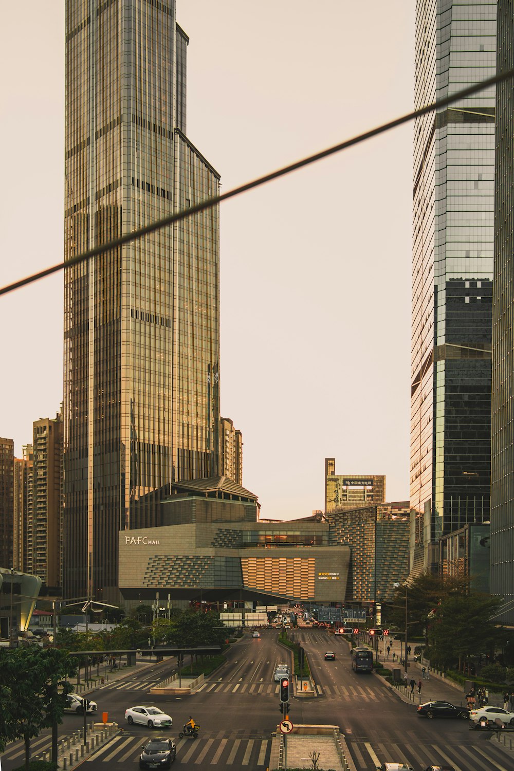 cars on road near high rise buildings during daytime