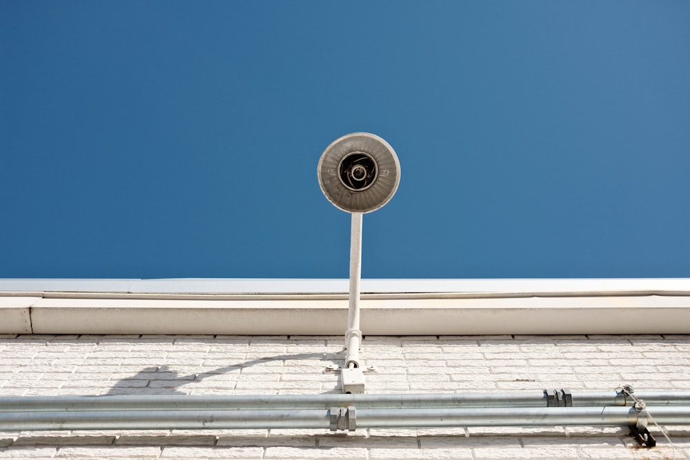 white and black round wall mounted device