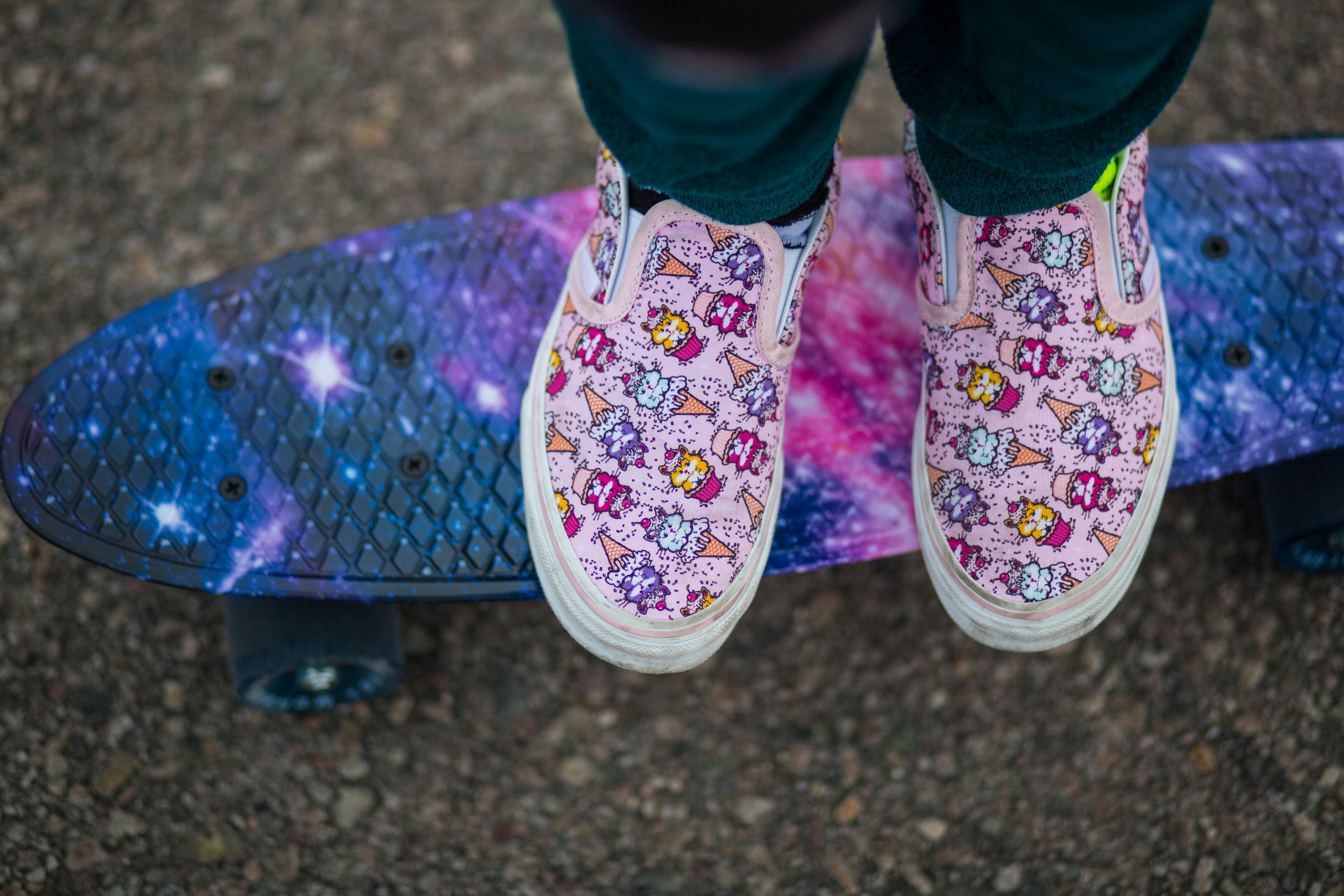 person wearing pink and white floral shoes