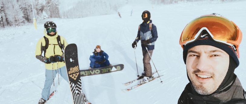 people in snow ski suit and snow ski blades