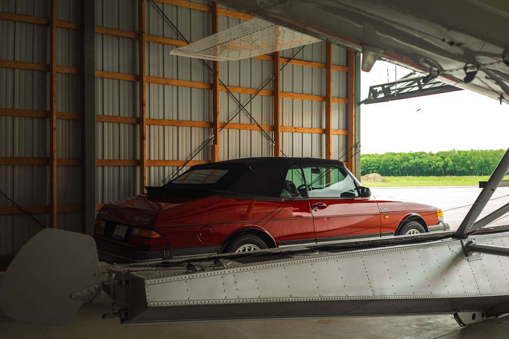 red convertible car on a trailer