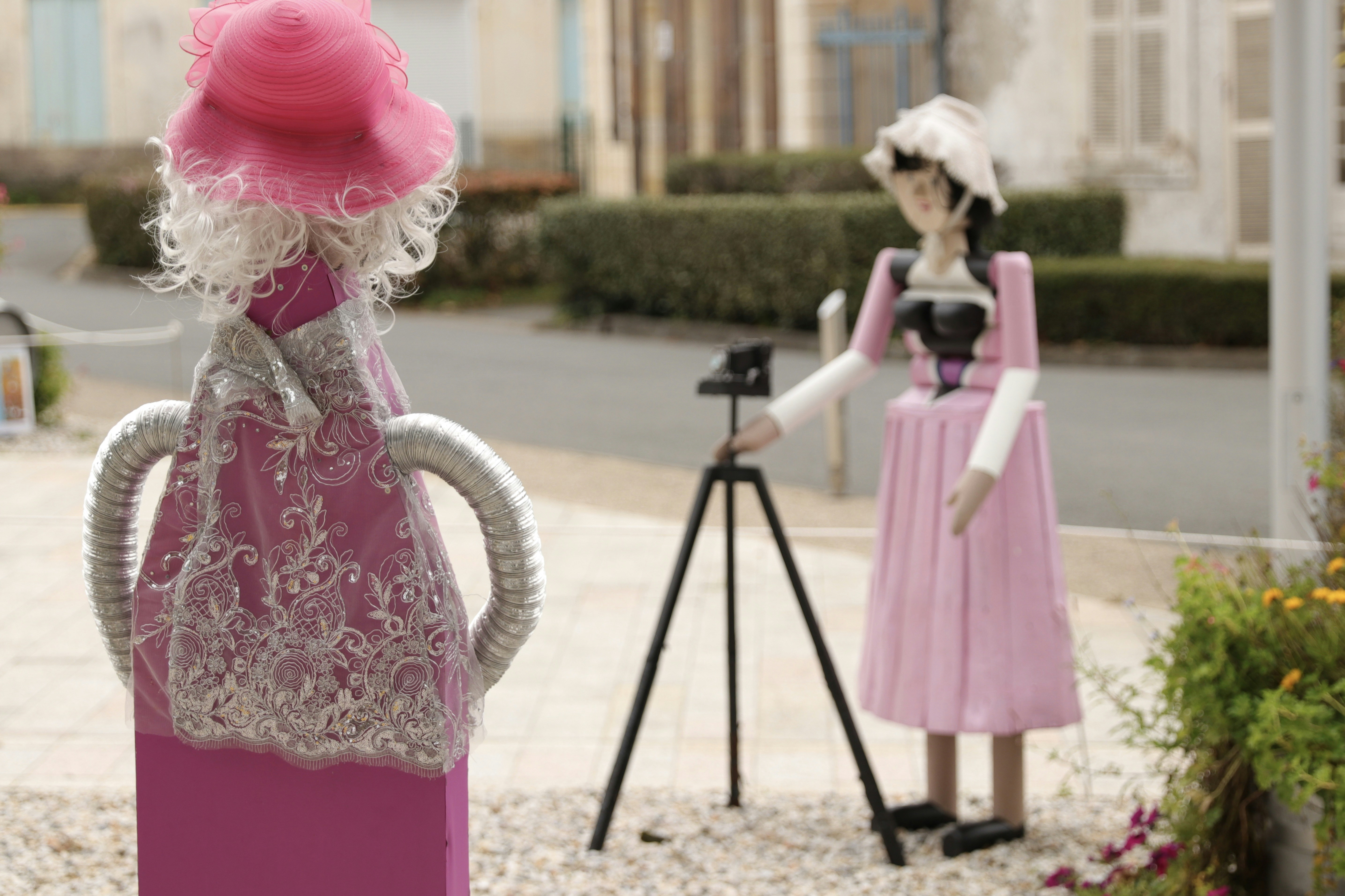 Array of pink dresses on mannequins