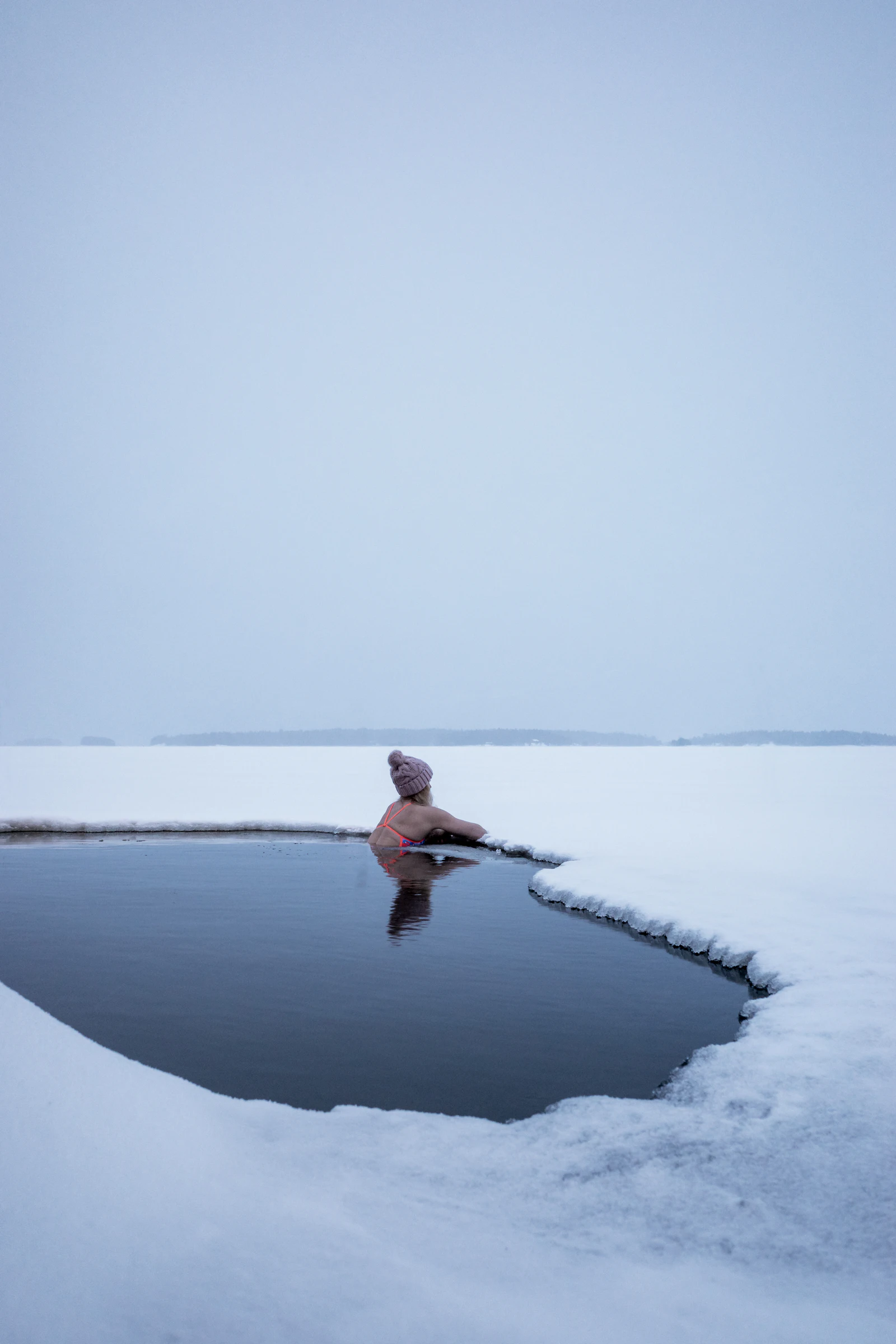 Cold open water swim under grey sky
