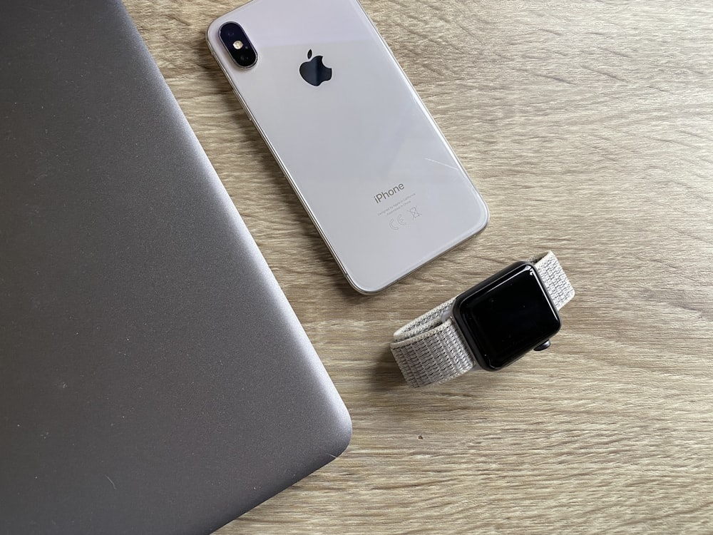 silver iphone 6 on brown wooden table