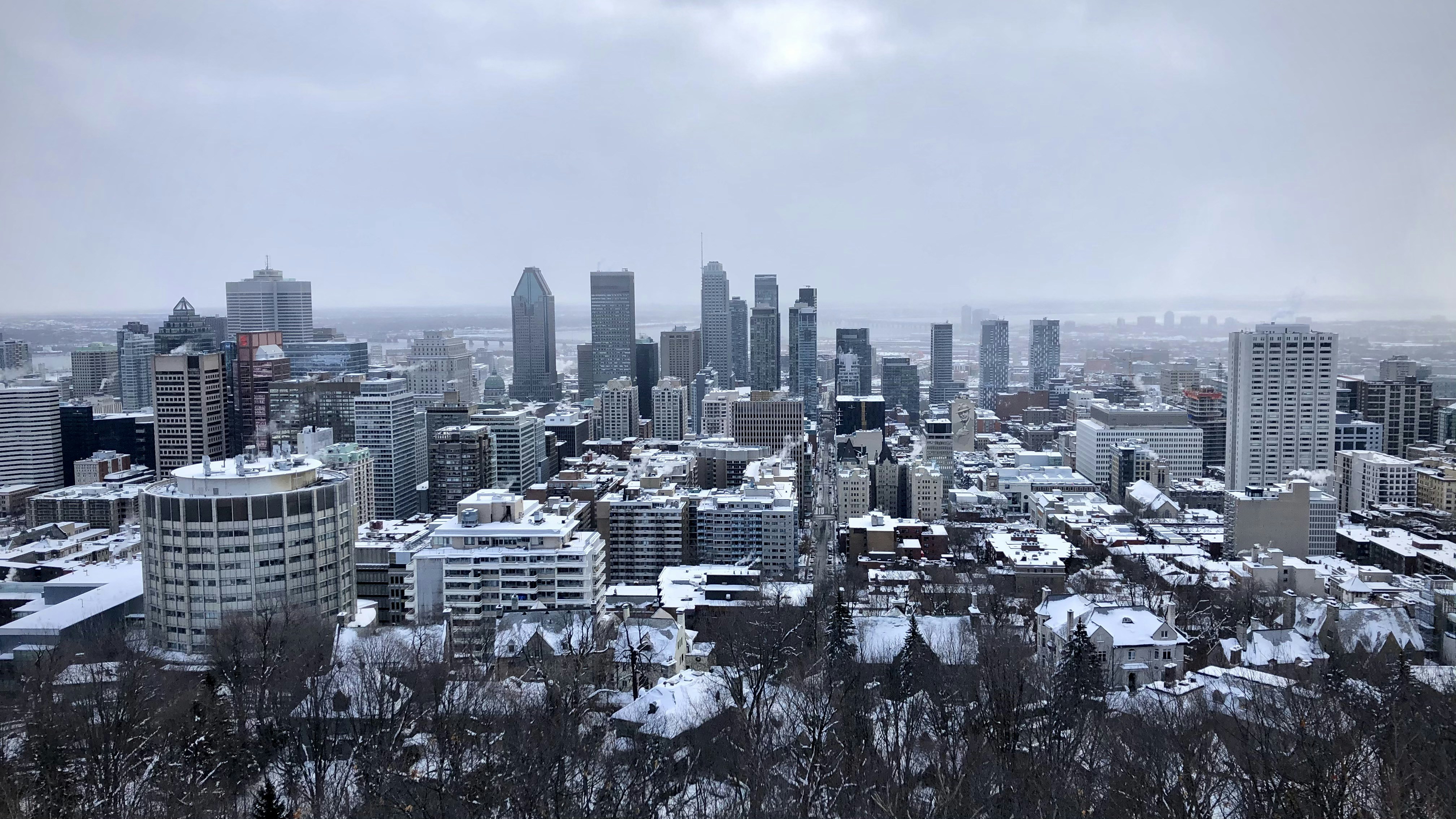 city skyline under gray cloudy sky during daytime