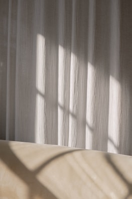 Soft natural lighting highlighting denim and silk fabrics.