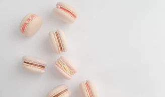 A colorful pastel macaron palette fishing gear set neatly arranged on white sand.