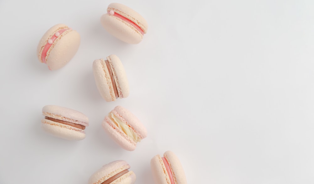 a group of macaroons sitting on top of a white table