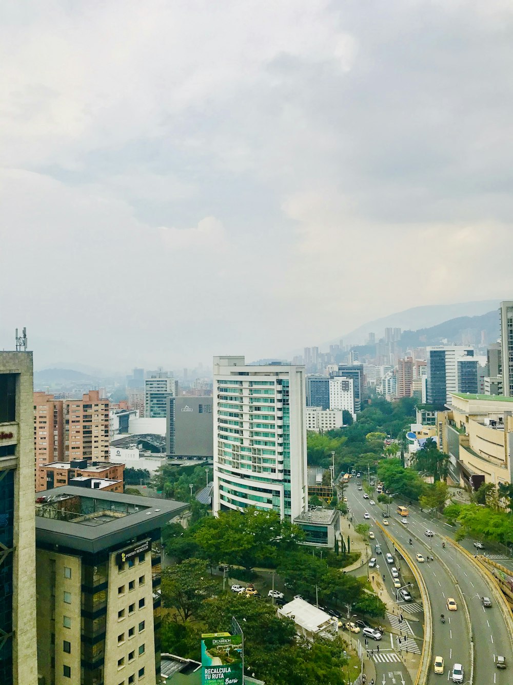 city buildings under white sky during daytime