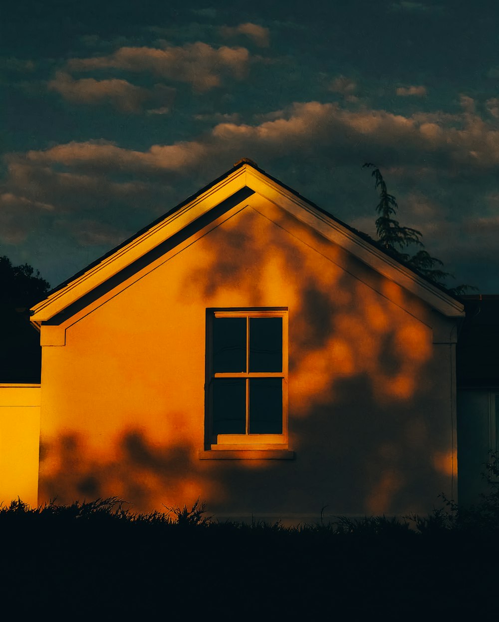 yellow and white wooden house under blue sky