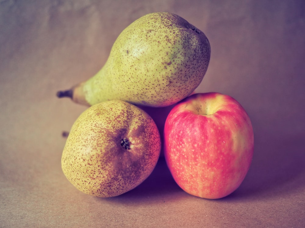 two green and red apples