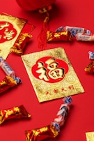 Bright red envelopes and golden decorations laid out for Tet gifting.
