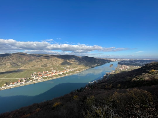 aerial view of lake and mountains during daytime in Hundsheim Austria
