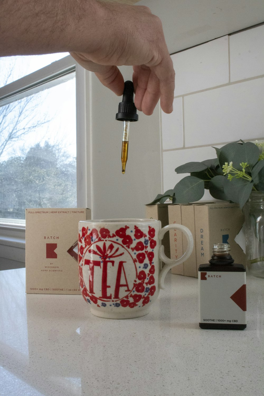 white and red ceramic mug