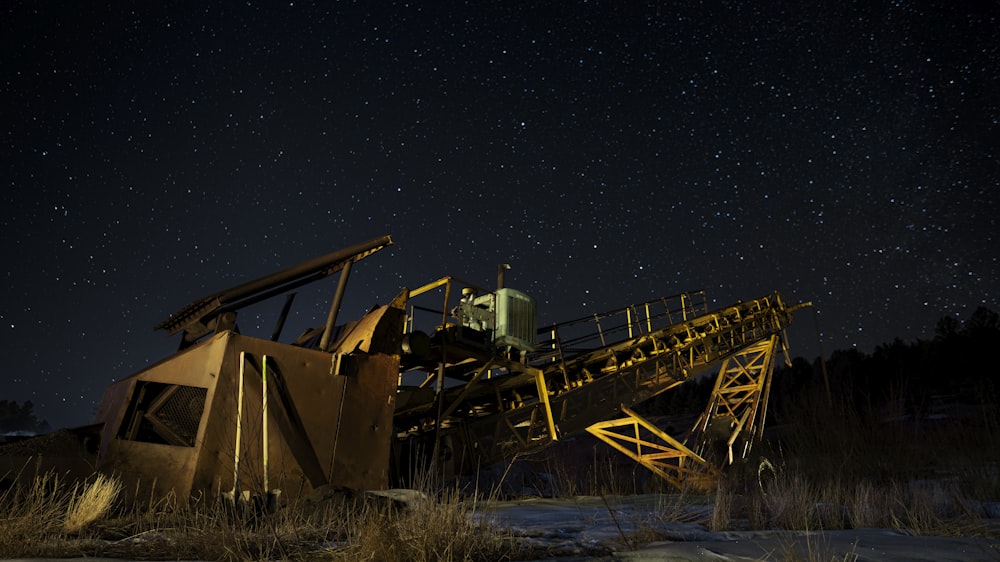 brown and black metal crane under starry night
